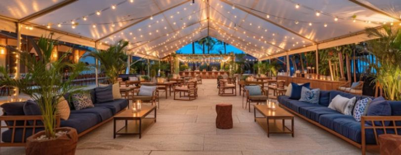 Planning a Backyard Wedding? Here’s How to Create the Perfect Vibe 8 backyard wedding dj. Covered outdoor wedding lounge with cozy seating and string lighting