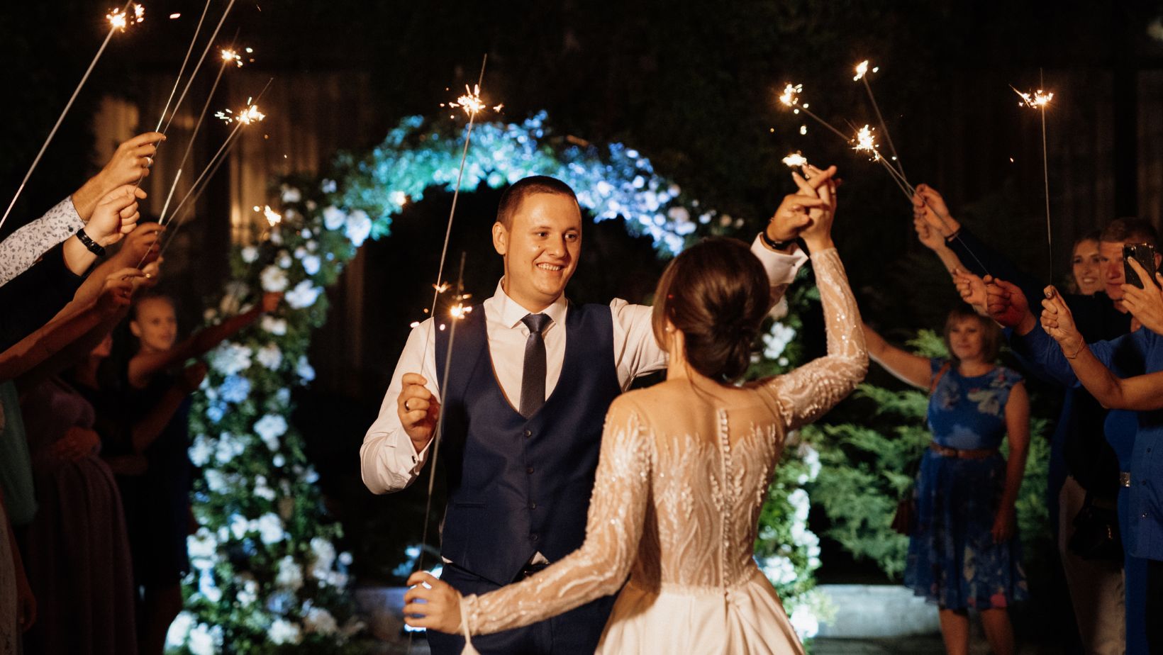 Wedding DJ cost in Michigan reflected in a beautifully coordinated sparkler send-off celebration